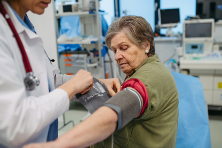 Senior woman having blood pressure checked, preventive care.の写真素材