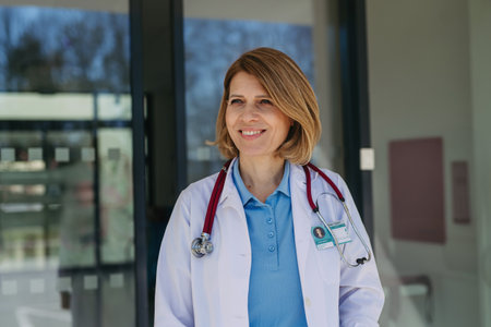Portrait of female doctor in uniform, smiling.の写真素材