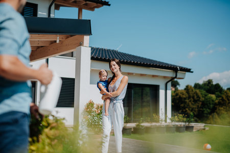 Joyful family moment in backyard with childの写真素材