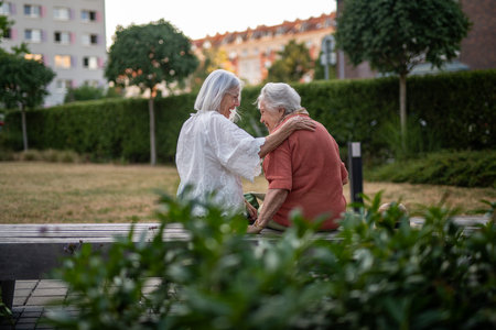 Tender moment between elderly mother and adult daughter.の写真素材