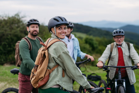 Family biking adventure in nature. Cycling trip during autumn day.の写真素材