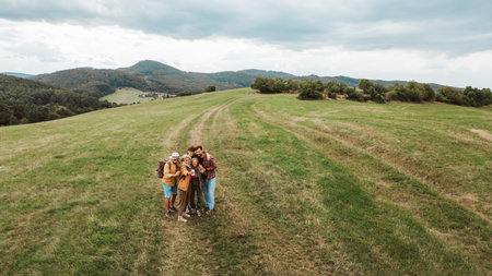 Aerial view of multigenerational family taking selfie on hiking trip in nature.の写真素材