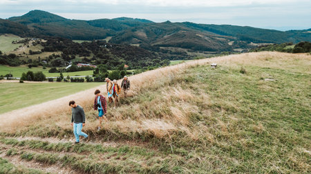 Aerial view of multigenerational family on hiking trip in nature.