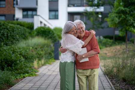 Portrait of beautiful adult daughter with old mother.の写真素材
