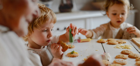 Family holiday baking with grandma in cozy kitchen.の写真素材
