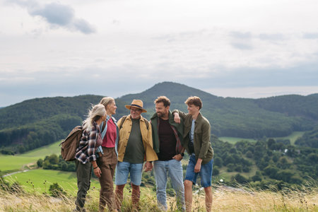 Multigenerational family on hiking trip in nature.