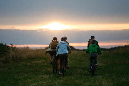Family biking adventure in nature. Cycling trip during autumn day.の写真素材