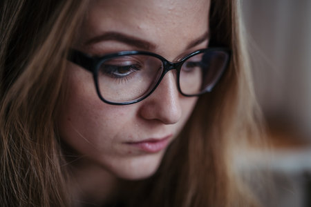 Depressed woman at home, portrait.の写真素材