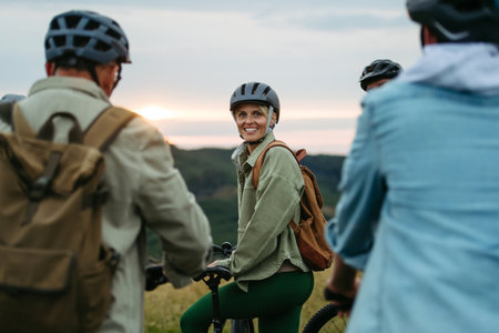 Happy woman during family biking adventure in nature.の写真素材