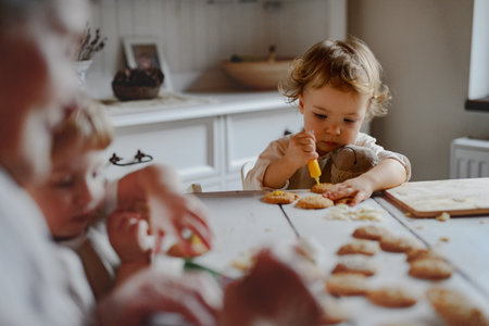 Family holiday baking with grandma in cozy kitchen.