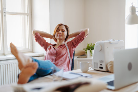 Female fashion designer starting her own small sewing business.の写真素材