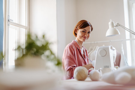 Female fashion designer starting her own small sewing business.の写真素材