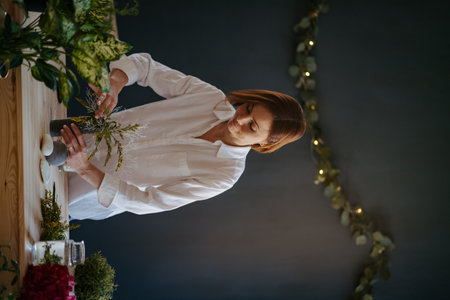 Female florist working in her small flower shop.の写真素材