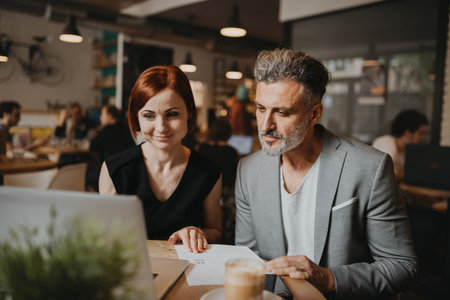 Man and woman having business meeting in a coffee shop.の写真素材