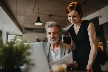 Man and woman having business meeting in a coffee shop.の写真素材