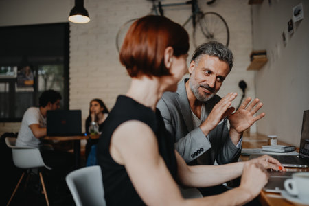 Man and woman having business meeting in a coffee shop.の写真素材