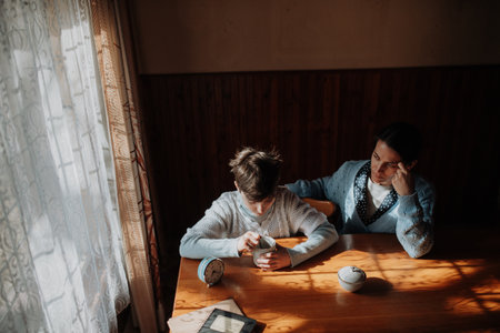 Single mother with her child during hard times.の写真素材
