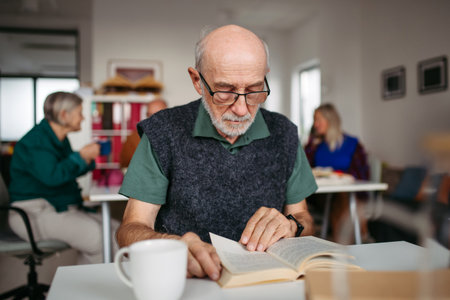 Group of senior people enjoying different activities in community center.の写真素材