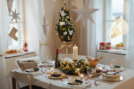 A table set for dinner meal at Christmas time.の写真素材