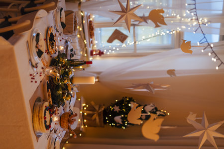 A table set for dinner meal at Christmas time.の写真素材