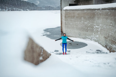 Active elderly woman in cold snowy weather.の写真素材