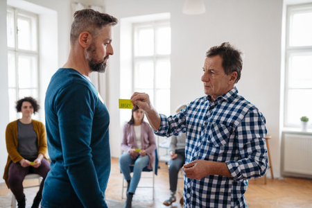 Participants labeling feelings during therapeutic workshop.の写真素材