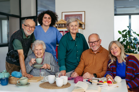 Nurse and group of elderly patients spending time together in community center.の写真素材