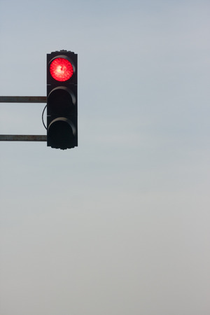 Traffic red light against sky, semaphore is showing red light