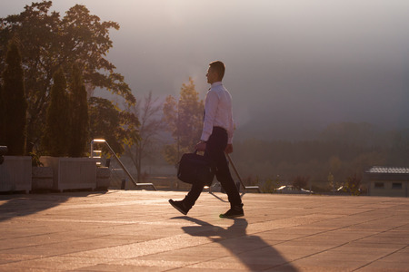 Young beautiful ambitious business man silhouetteの写真素材