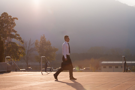 Young beautiful ambitious business man silhouetteの写真素材