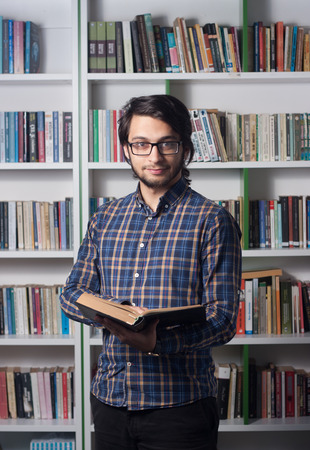 Young student studying in libraryのeditorial素材