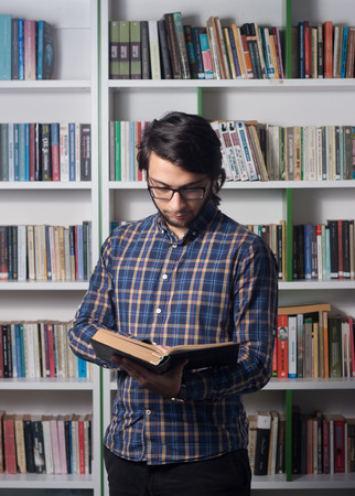 Young student studying in libraryのeditorial素材