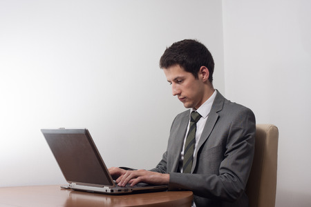 Portrait of handsome young male businessman in suitの写真素材