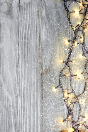 Christmas fir tree with decoration on a wooden boardの写真素材
