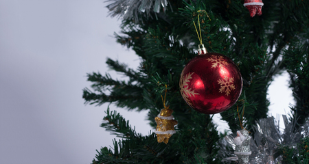 Christmas tree decorated with ornaments and giftsの写真素材