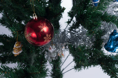 Christmas tree decorated with ornaments and giftsの写真素材