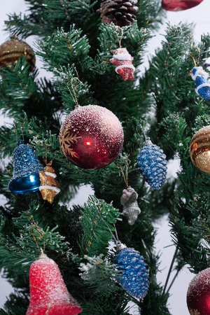 Christmas tree decorated with ornaments and giftsの写真素材