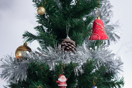 Christmas tree decorated with ornaments and giftsの写真素材
