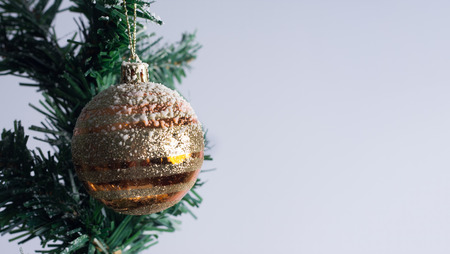 Christmas tree decorated with ornaments and giftsの写真素材