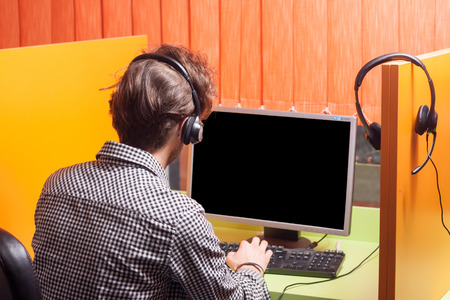 Handsome young call center agent at workの写真素材