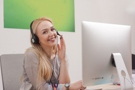 Handsome young call center agent at workの写真素材