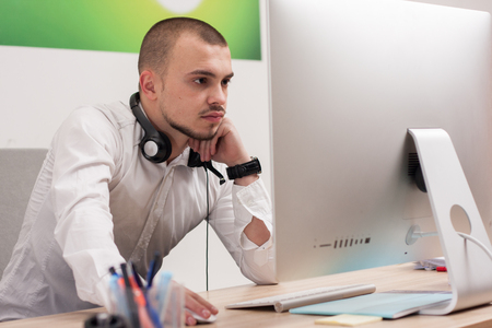 Handsome young call center agent at workの写真素材