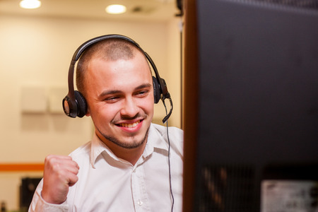 Handsome young call center agent at workの写真素材