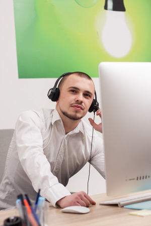 Handsome young call center agent at workの写真素材