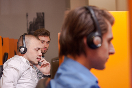 Handsome young call center agent at workの写真素材