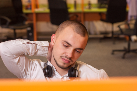 Handsome young call center agent at workの写真素材