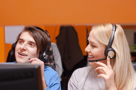Portrait of call center agent at work in box officeの写真素材