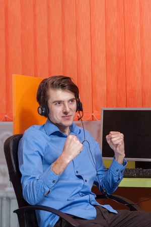 Portrait of call center agent at work in box officeの写真素材