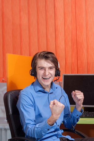 Portrait of call center agent at work in box officeの写真素材