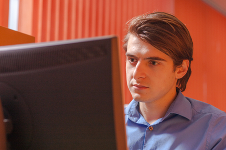 Portrait of call center agent at work in box officeの写真素材